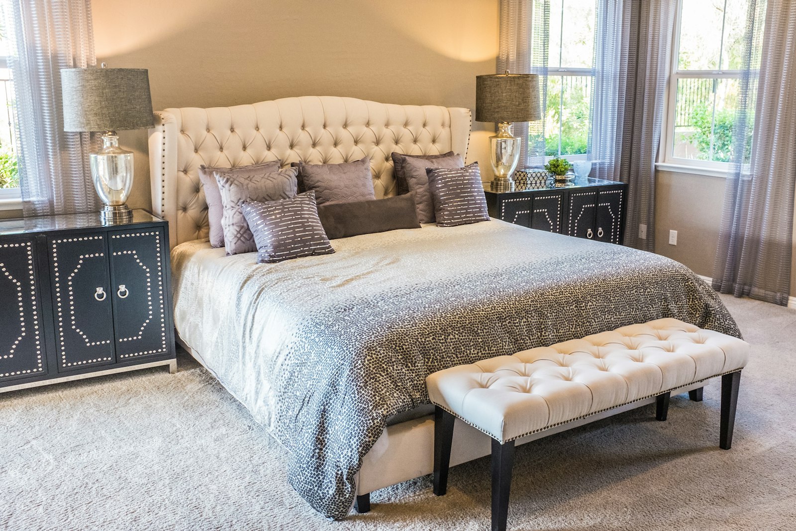 Warm classic bedroom with upholstered bed and timber flooring