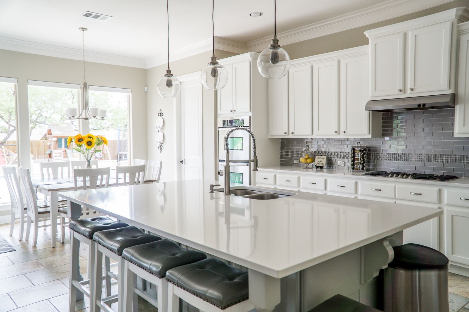 Bright white kitchen with large island in the Bishan resale flat