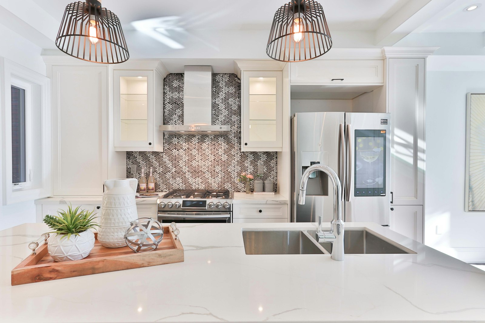 White kitchen with a marble-effect sink counter and undermount basin