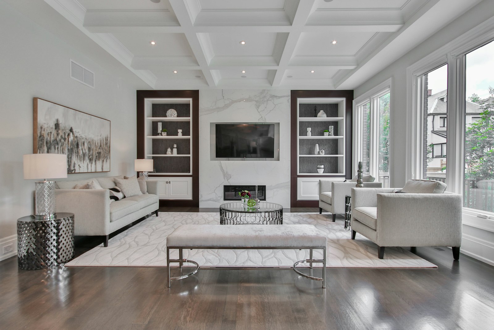 Resale flat living room with a coffered ceiling feature and warm, even flooring