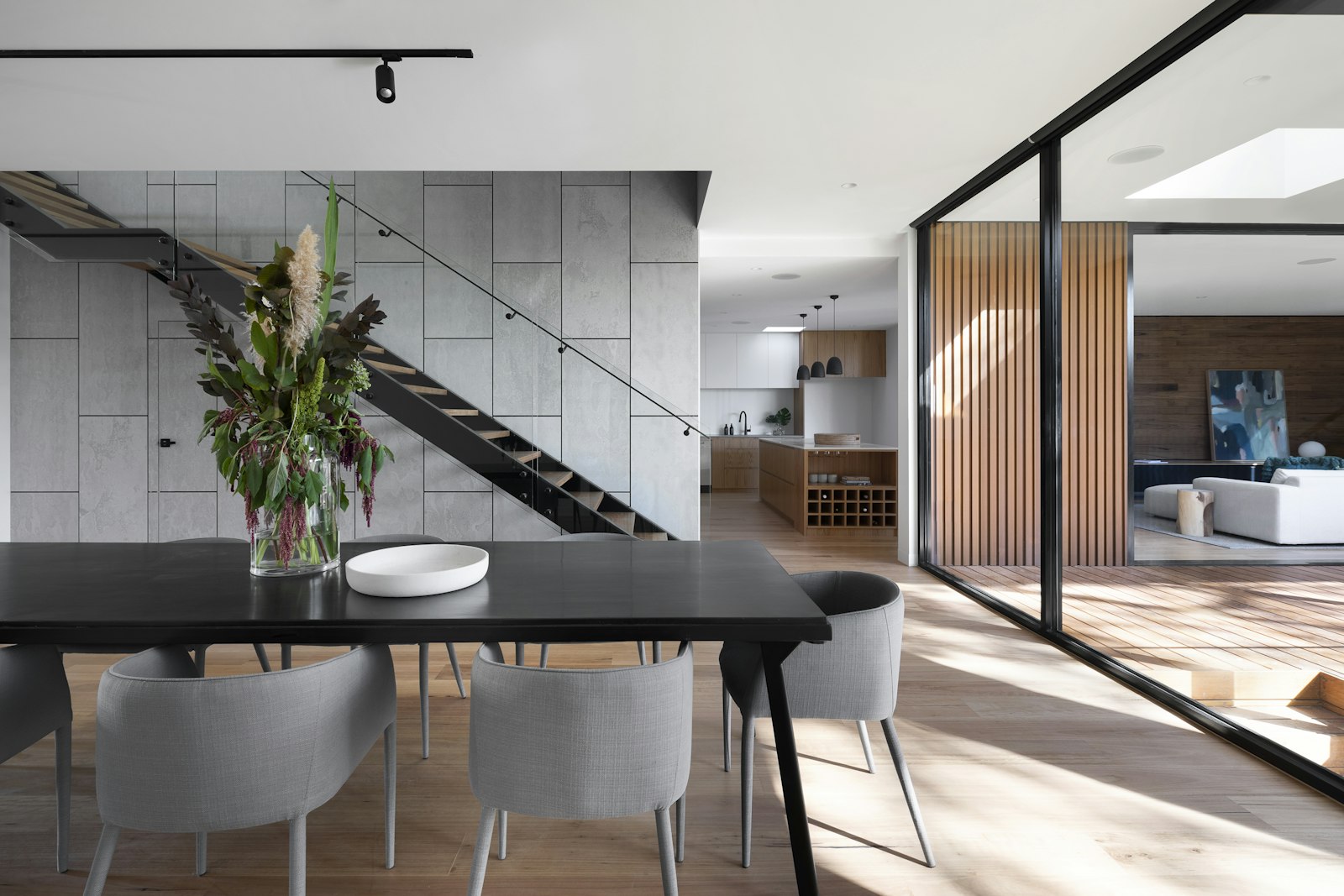 Fluted glass partition diffusing the room beyond