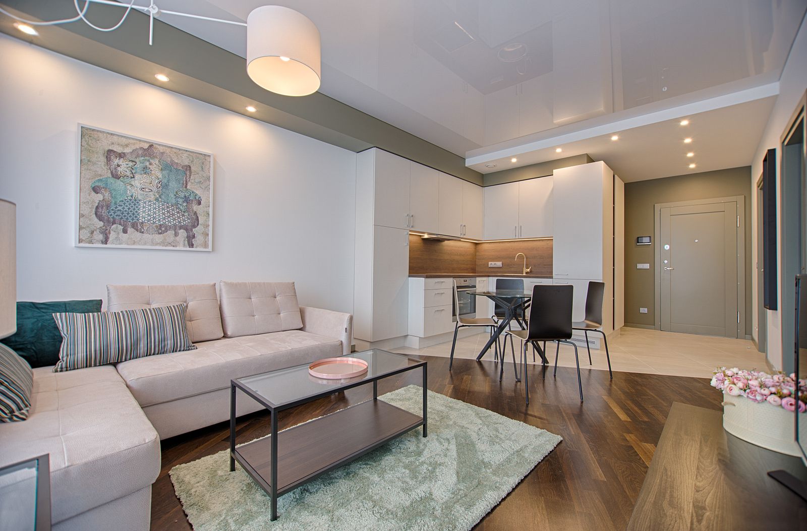 Landed-home living room with sectional sofa and large windows