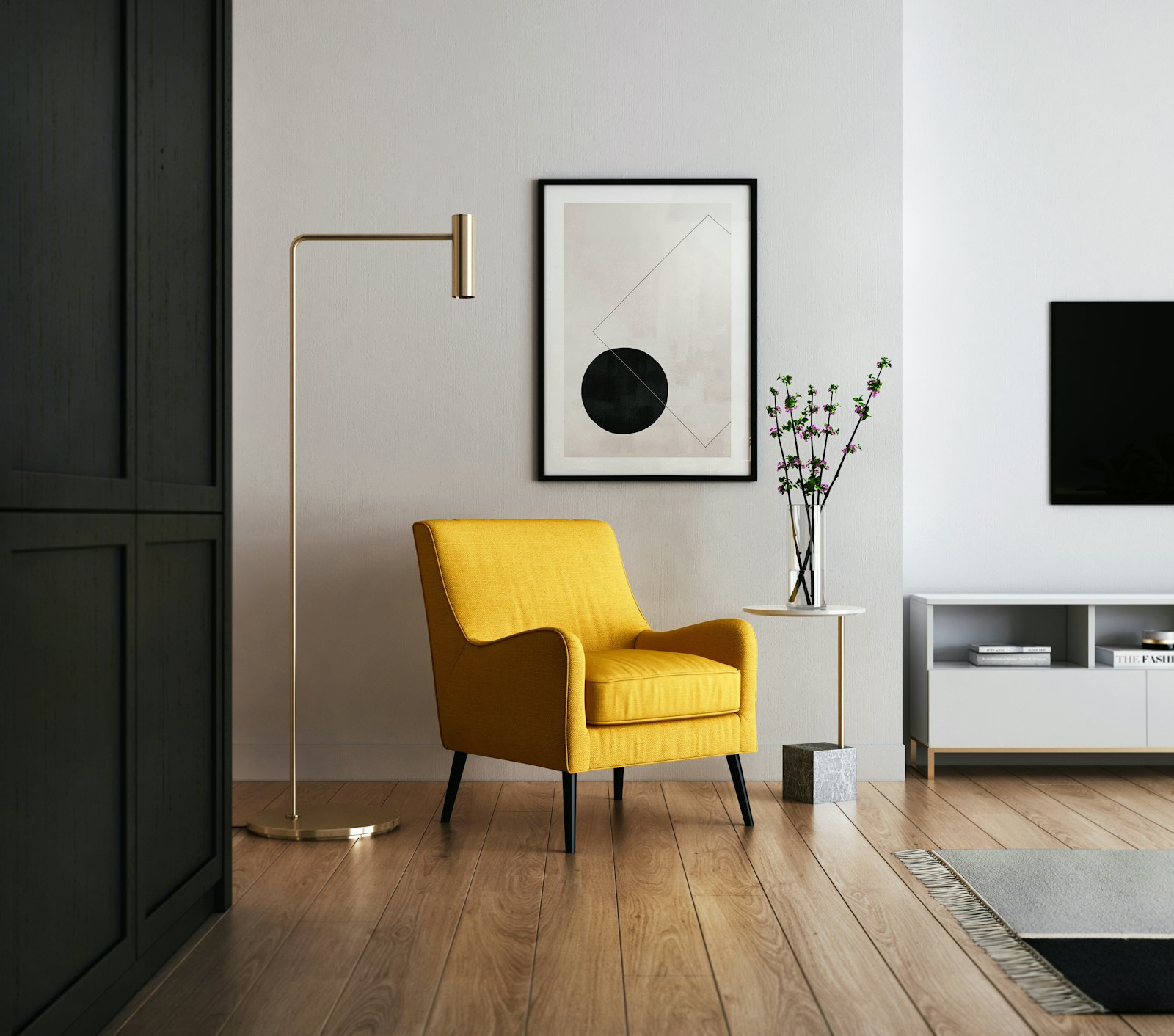 Brushed brass floor lamp beside a dark feature wall