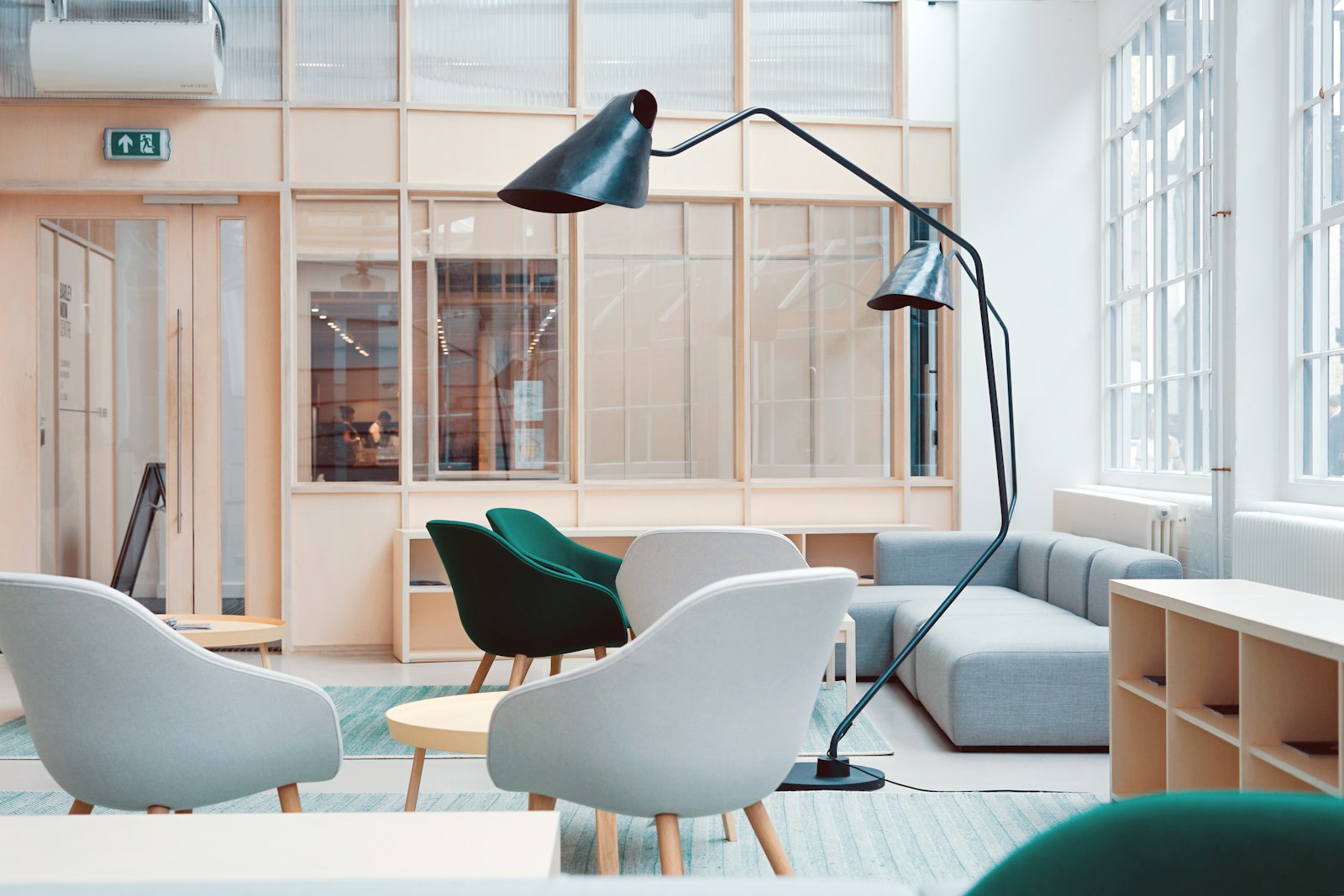 Reading corner with white lounge chairs and arc floor lamp